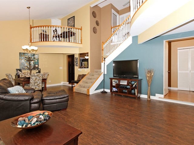 8819 Gardner Road Fox River Grove, IL 60021 - Photo 5 of 24 a living room with furniture and a flat screen tv
