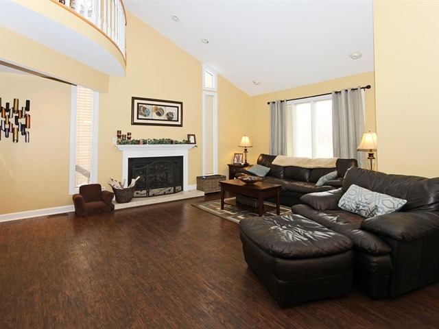 8819 Gardner Road Fox River Grove, IL 60021 - Photo 7 of 24 a living room with furniture and a fireplace
