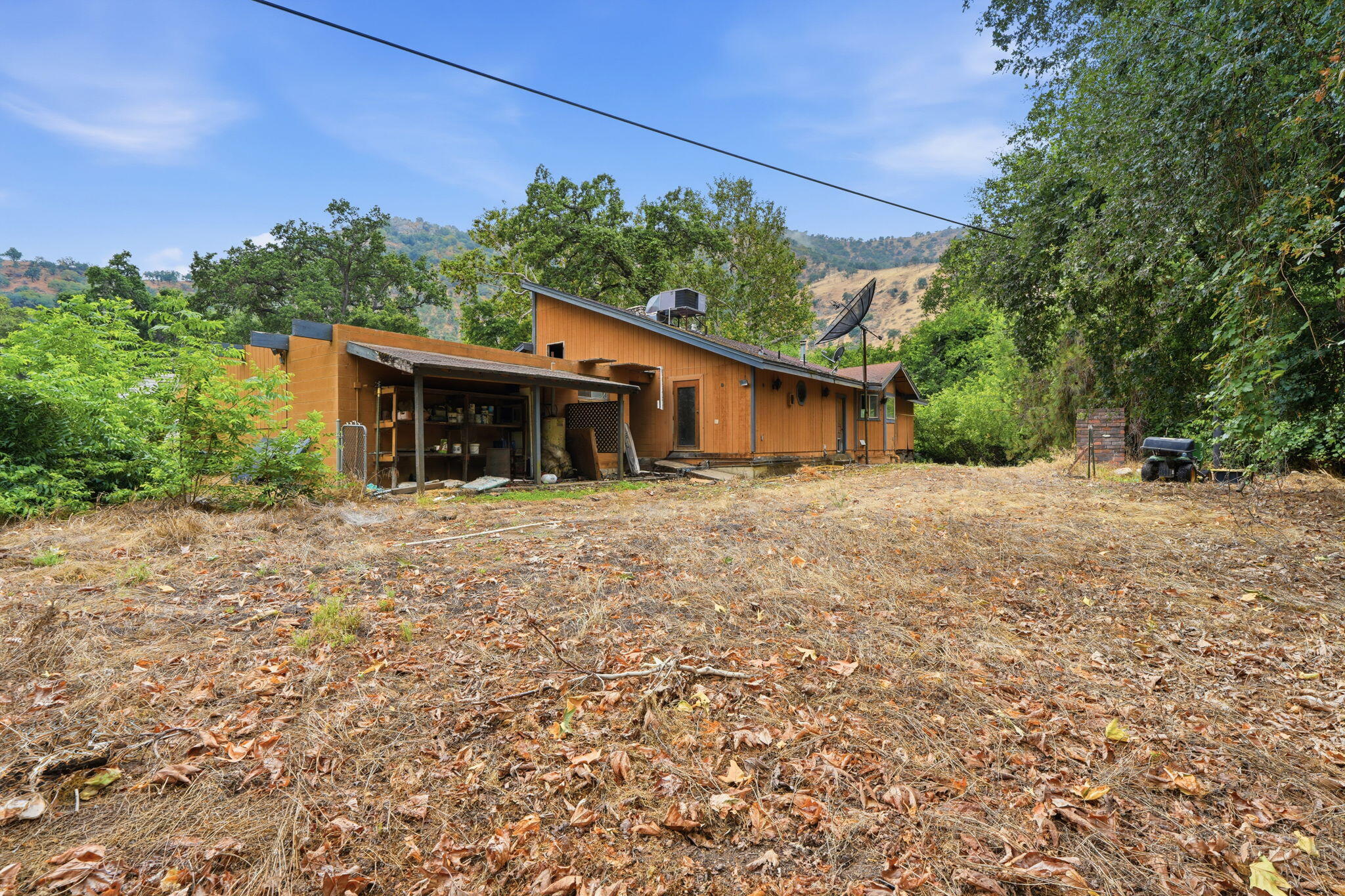 44065 South Fork Drive Three Rivers, CA 93271 - Photo 17 of 33 a front view of a house with a garden