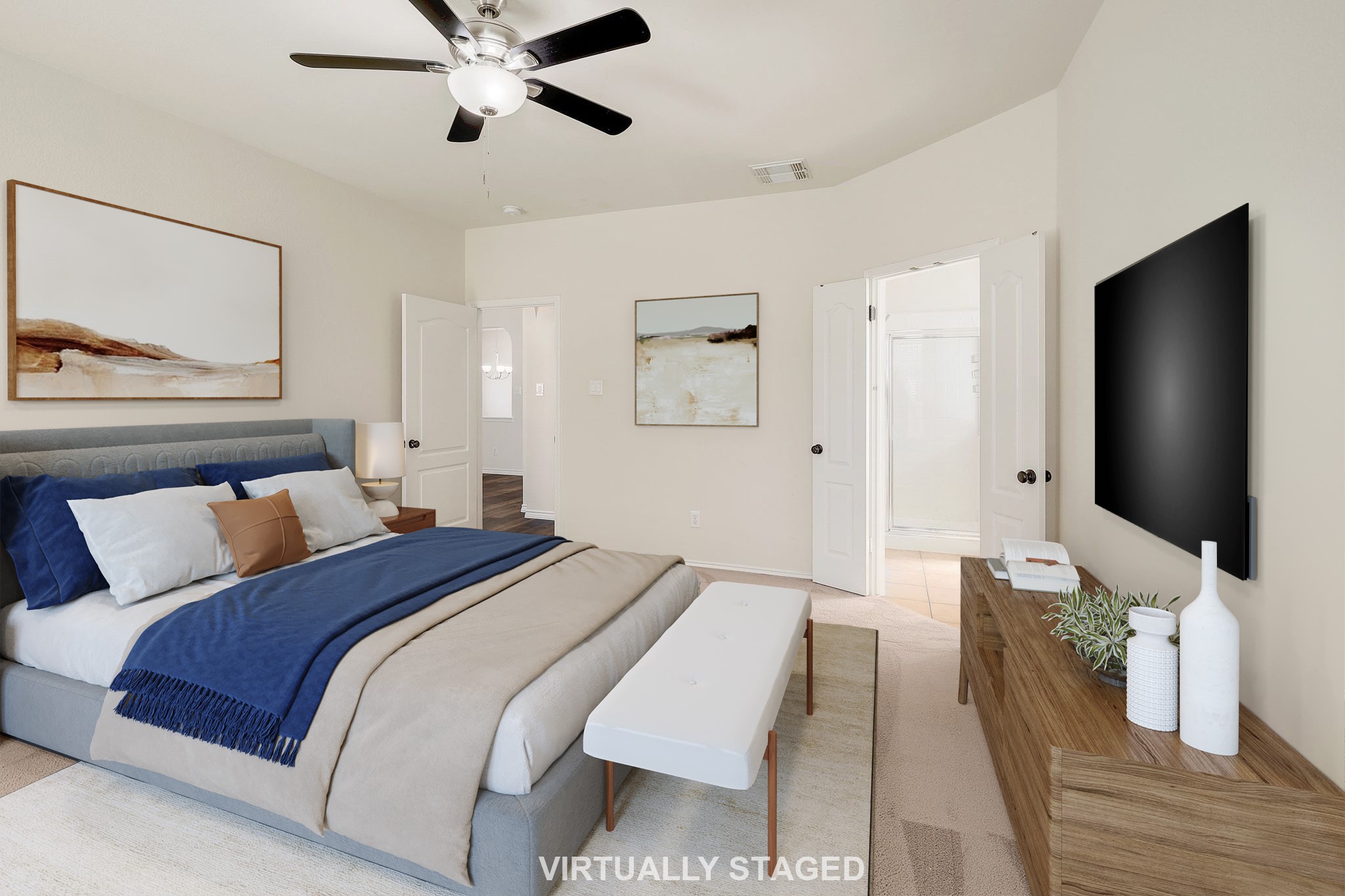 2307 Hayfield Square Pflugerville, TX 78660 - Photo 20 of 40 a bedroom with a bed and a flat screen tv