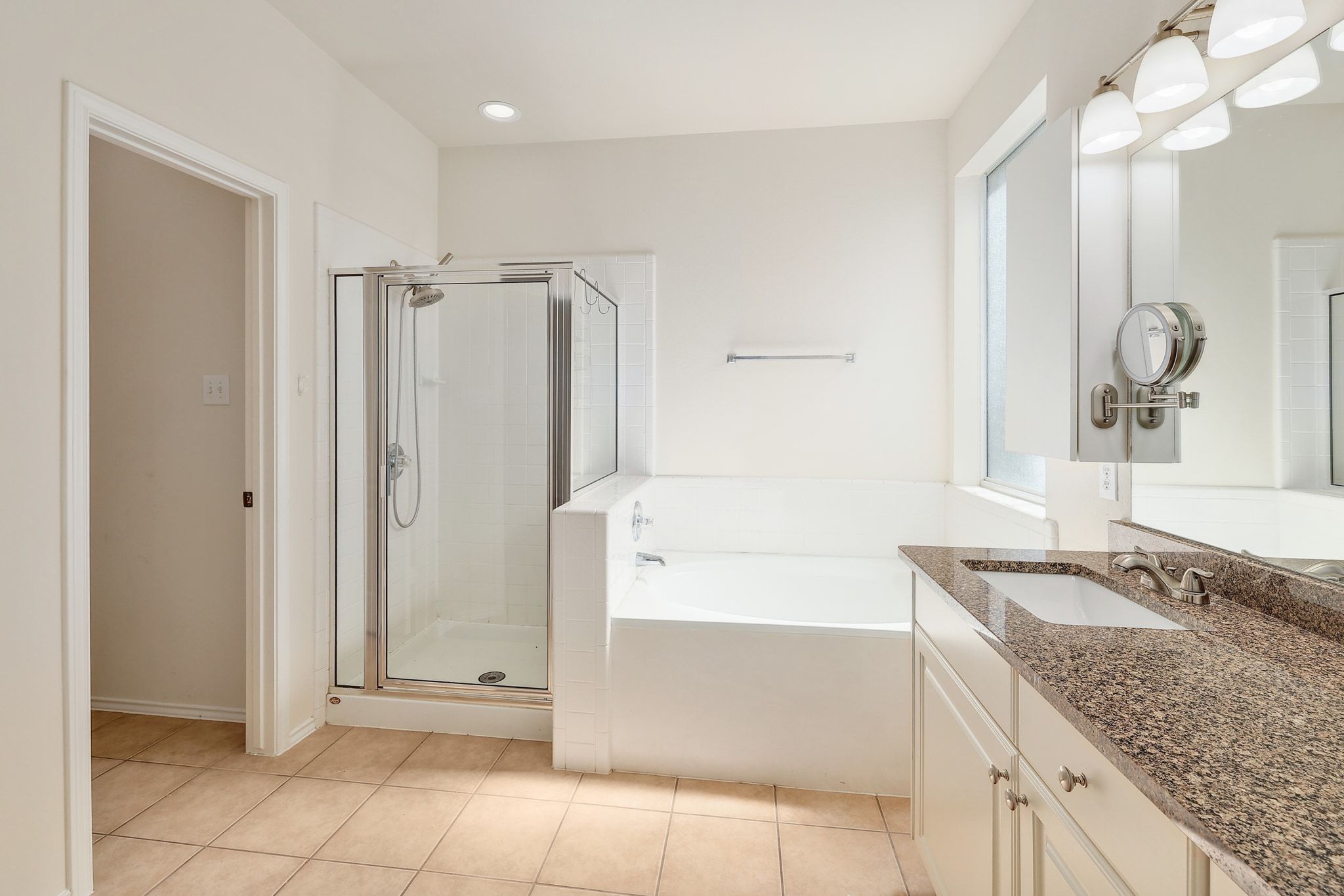 2307 Hayfield Square Pflugerville, TX 78660 - Photo 23 of 40 a bathroom with a granite countertop sink a mirror and a bathtub