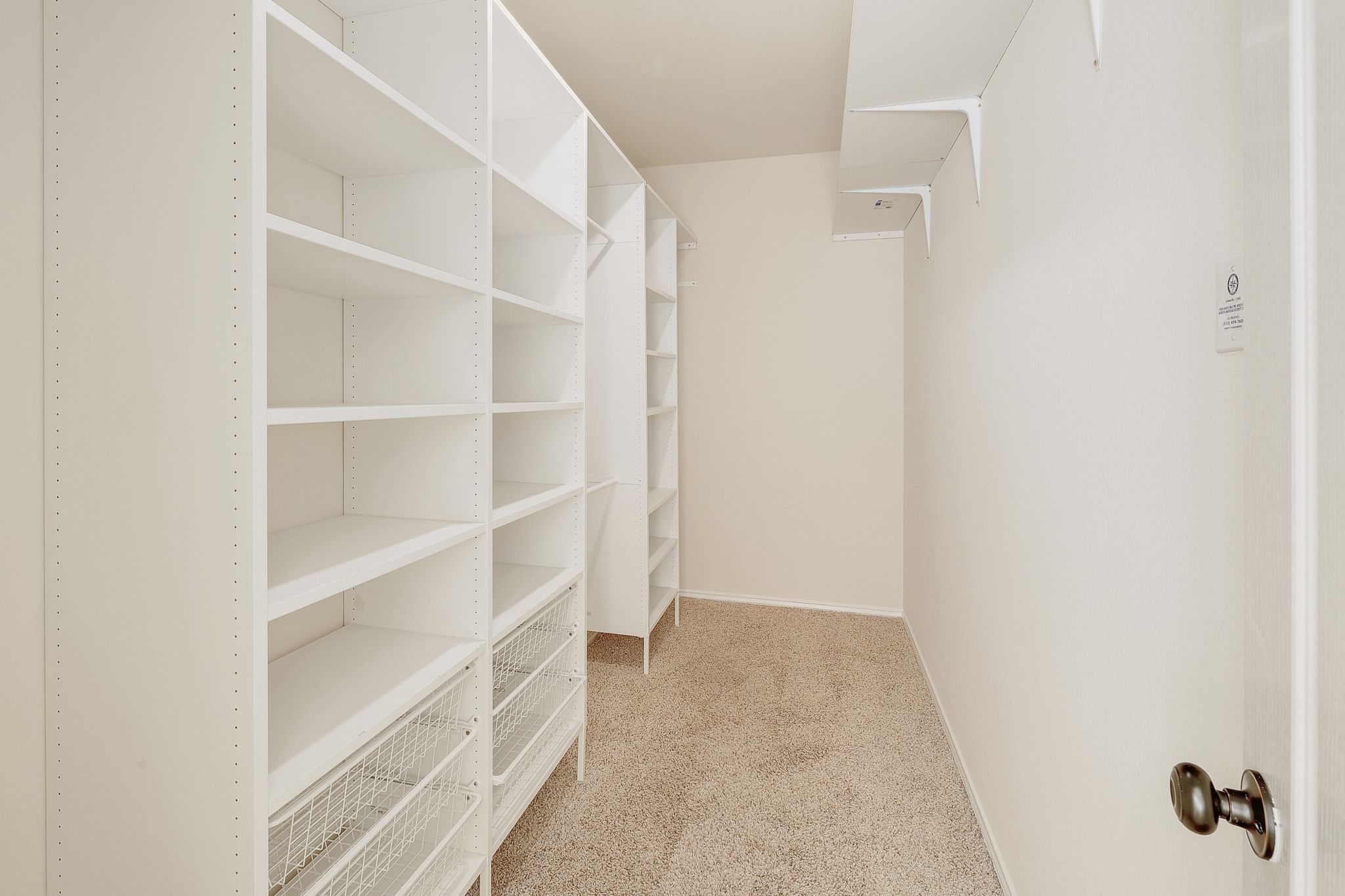 2307 Hayfield Square Pflugerville, TX 78660 - Photo 24 of 40 a view of walk in closet with empty racks