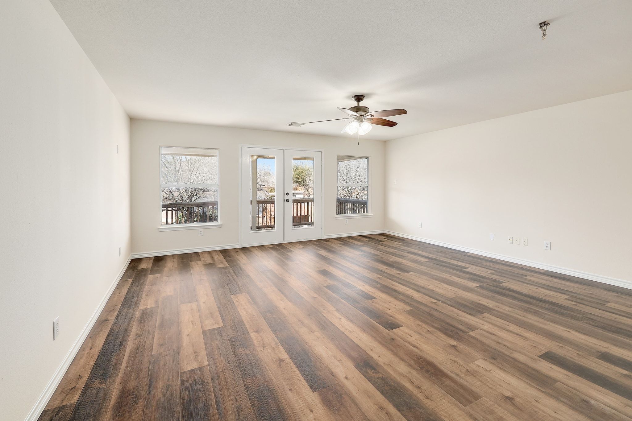2307 Hayfield Square Pflugerville, TX 78660 - Photo 29 of 40 wooden floor in an empty room with a window