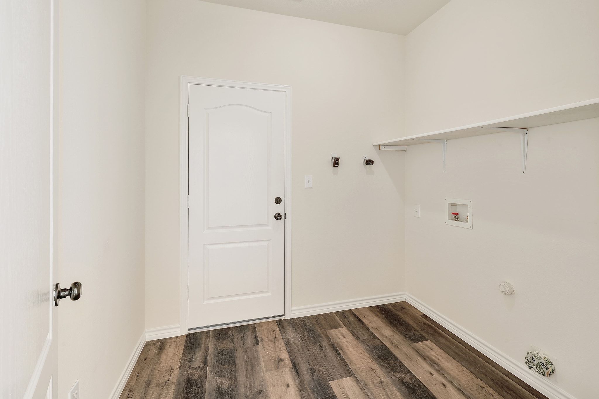 2307 Hayfield Square Pflugerville, TX 78660 - Photo 34 of 40 a view of walk in closet with wooden floor