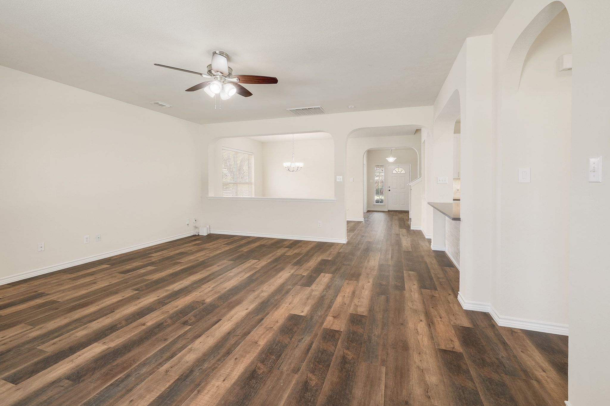 2307 Hayfield Square Pflugerville, TX 78660 - Photo 8 of 40 a view of empty room with wooden floor and fan