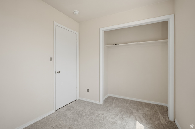 337 North Main Street Central Valley, UT 84754 - Photo 20 of 40 Unfurnished bedroom with light colored carpet and a closet