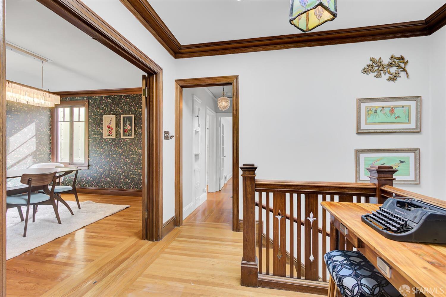 3927 Clement Street San Francisco, CA 94121 - Photo 12 of 72 a view of a hallway with chairs and front door with wooden floor
