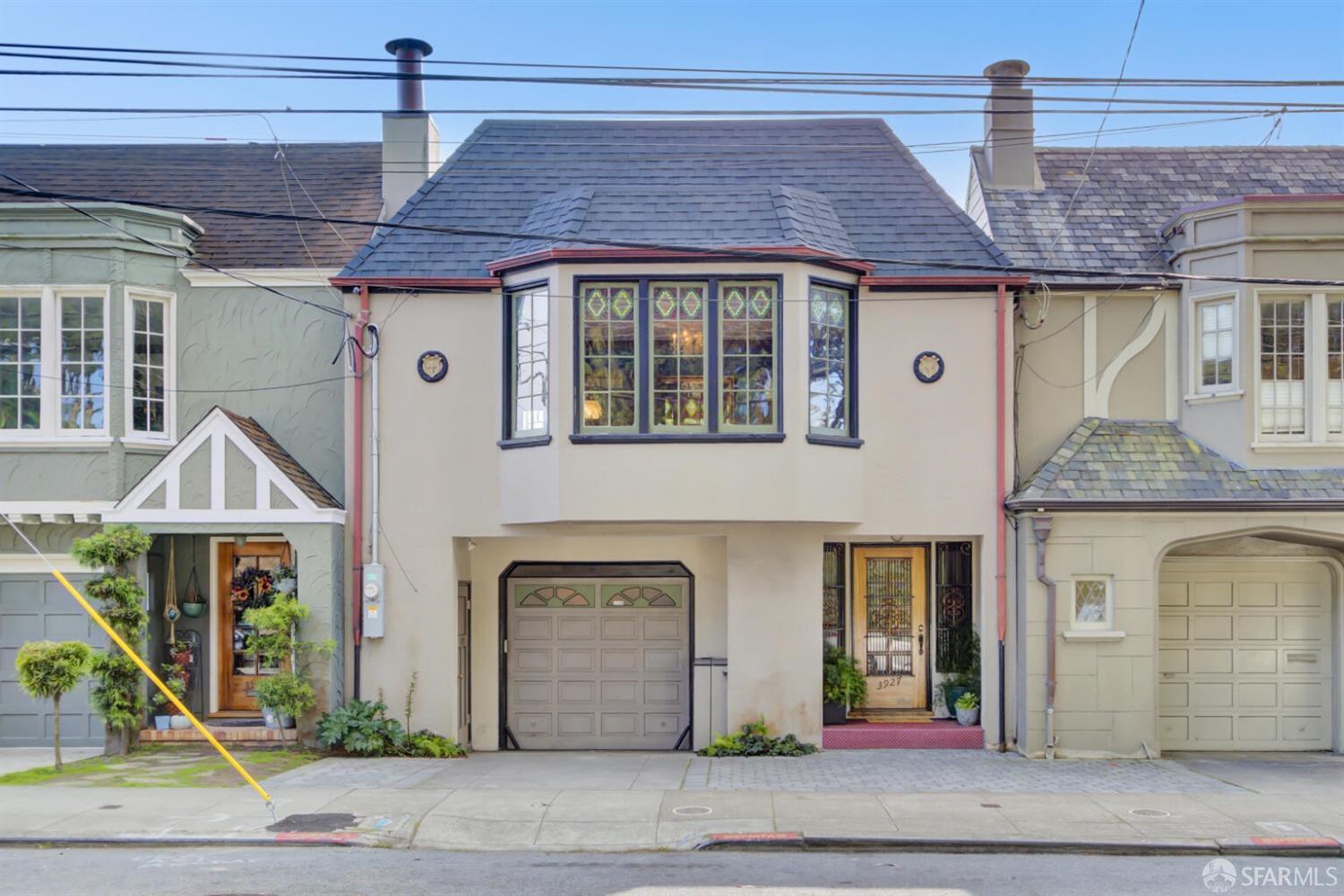 3927 Clement Street San Francisco, CA 94121 - Photo 2 of 72 a front view of a house with garden