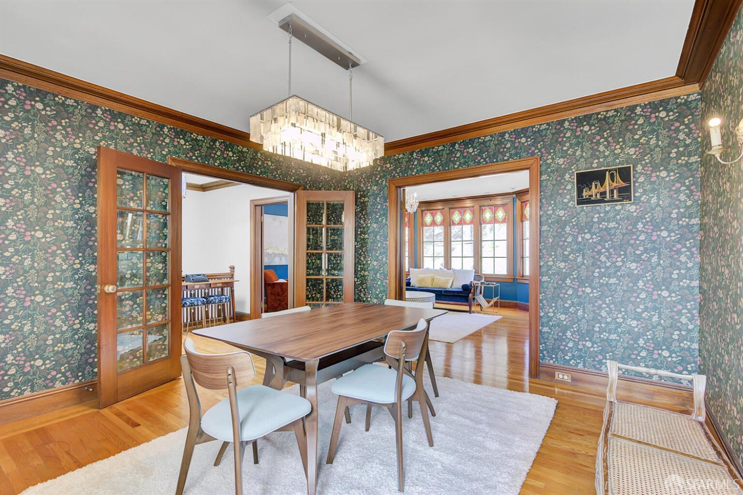 3927 Clement Street San Francisco, CA 94121 - Photo 22 of 72 a view of a dining room with furniture wooden floor and chandelier