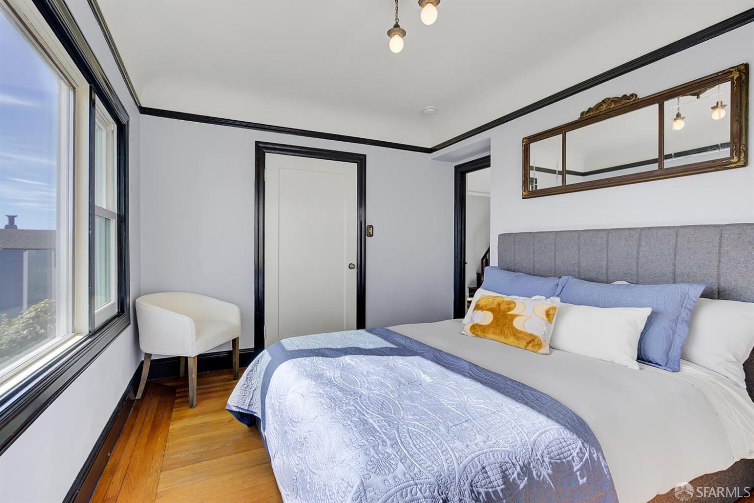 3927 Clement Street San Francisco, CA 94121 - Photo 33 of 72 a bedroom with a bed and a window