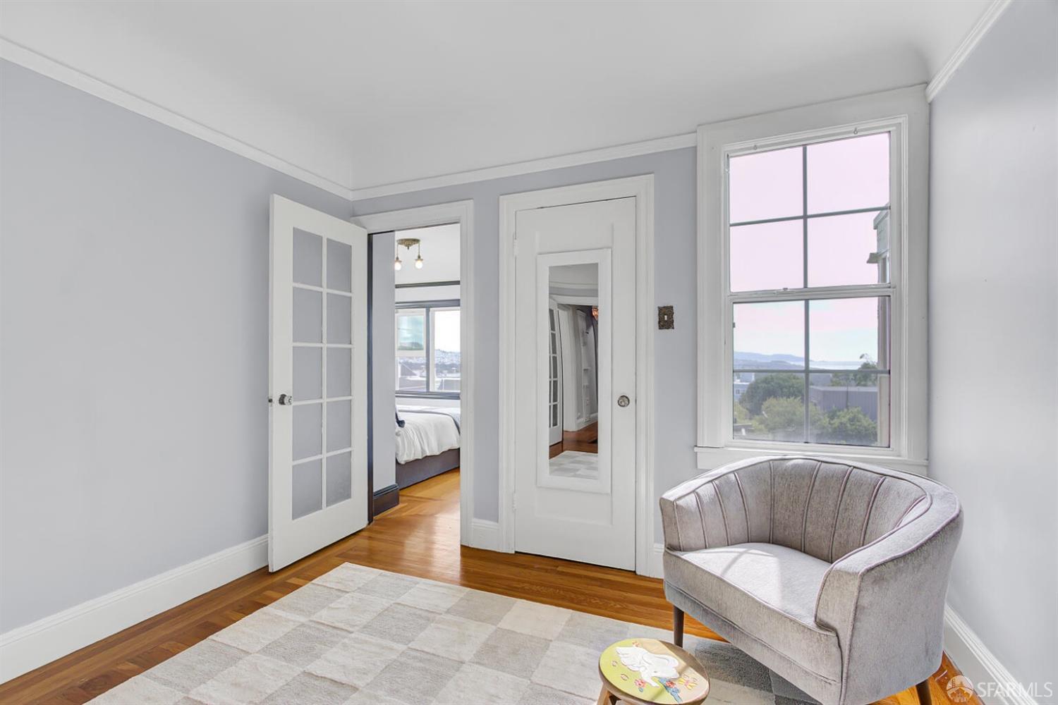 3927 Clement Street San Francisco, CA 94121 - Photo 37 of 72 a living room with furniture and a window