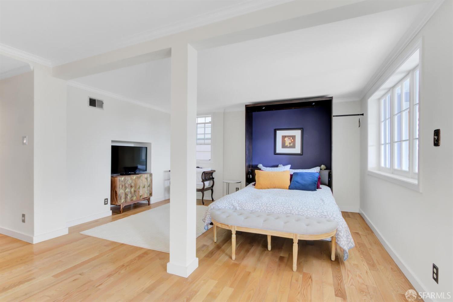 3927 Clement Street San Francisco, CA 94121 - Photo 41 of 72 a living room with furniture a flat screen tv and a table