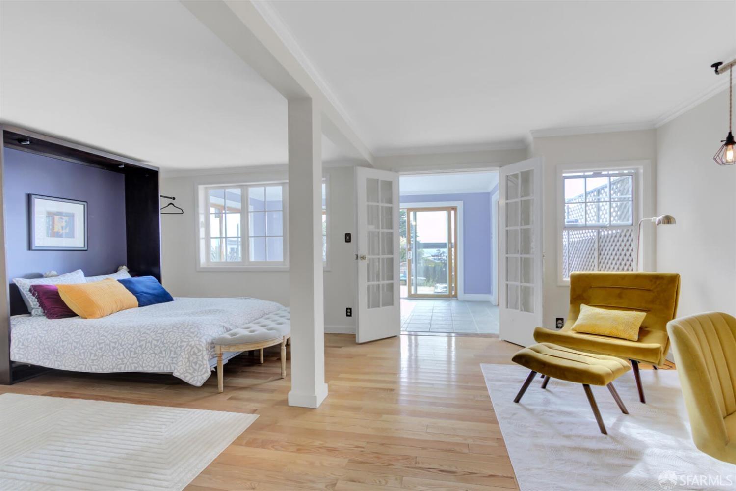 3927 Clement Street San Francisco, CA 94121 - Photo 42 of 72 a bedroom with a bed and wooden floor