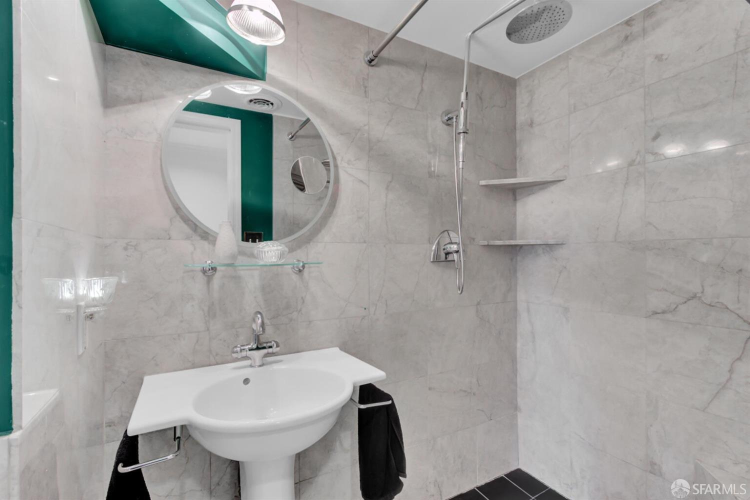 3927 Clement Street San Francisco, CA 94121 - Photo 46 of 72 a bathroom with a sink a mirror and vanity