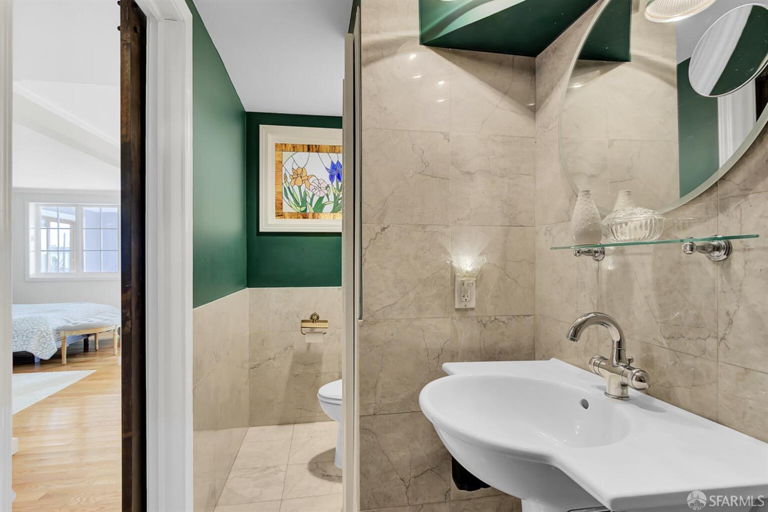 3927 Clement Street San Francisco, CA 94121 - Photo 47 of 72 a bathroom with a sink and a mirror