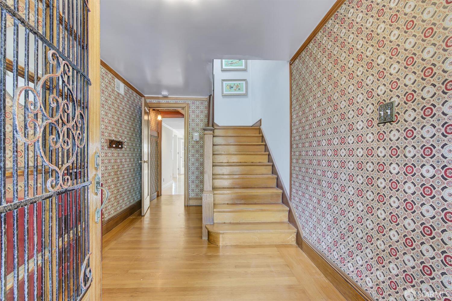 3927 Clement Street San Francisco, CA 94121 - Photo 6 of 72 a view of a hallway with wooden floor and entryway