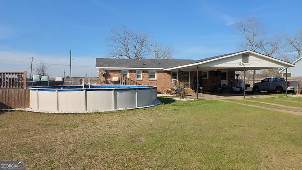 a view of a house with a swimming pool