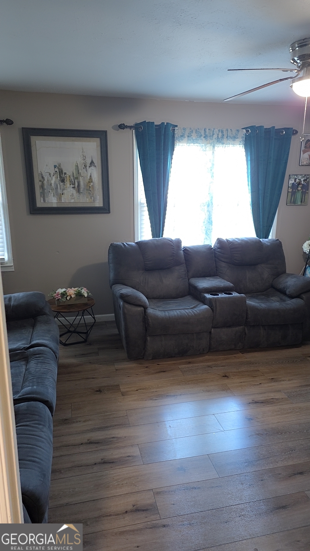 293 Williams Street Northeast Pelham, GA 31779 - Photo 4 of 19 a living room with furniture and a window