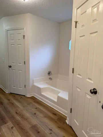 a bathroom with a bathtub and a shower