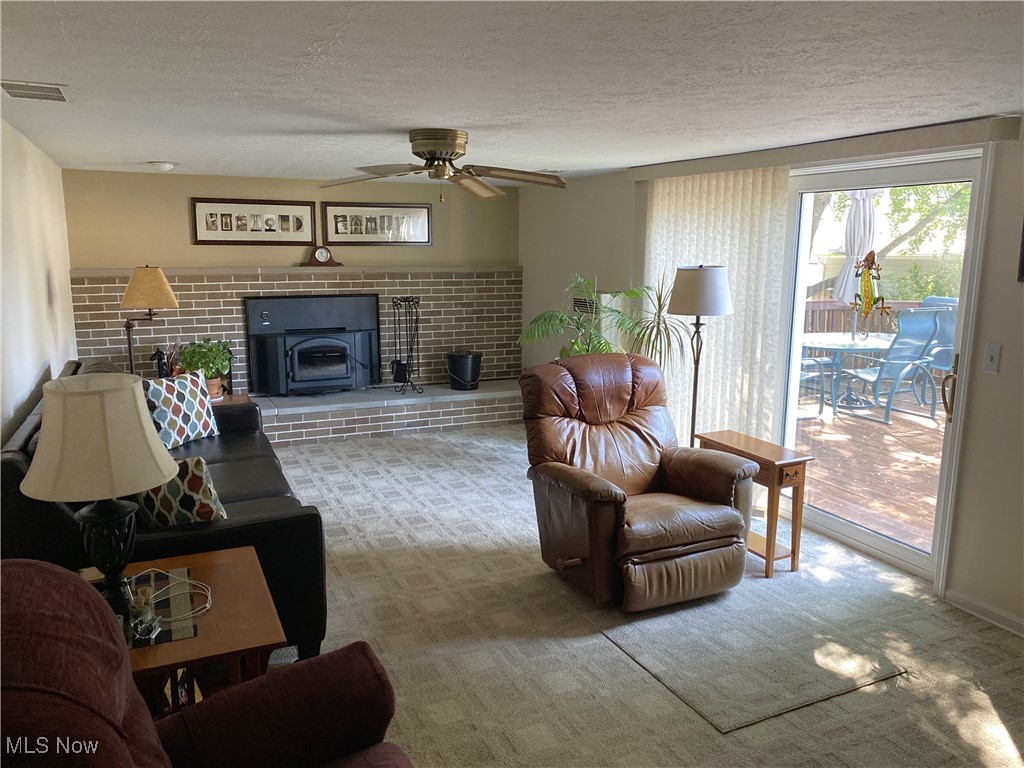 2478 Barrington Road Akron, OH 44333 - Photo 9 of 23 The lower level family room has a fireplace and sliding glass doors to the deck and back yard
