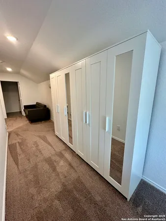 a view of a closet in a room