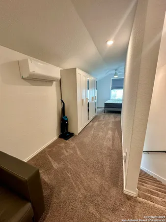 a view of livingroom with furniture and stairs