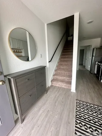 a view of a livingroom with wooden floor