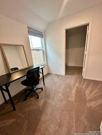 a view of workspace with hardwood wall