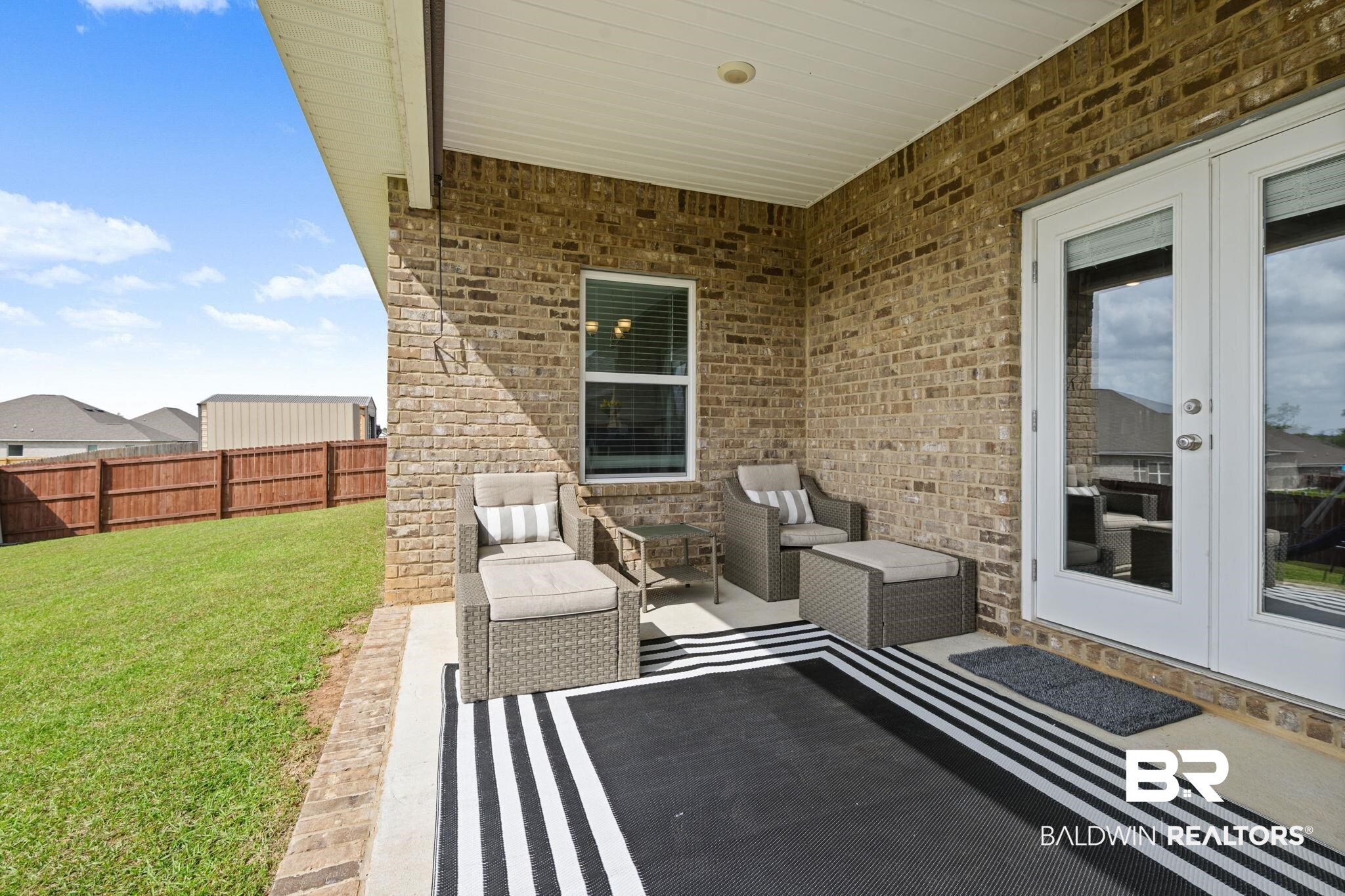 2183 Meadowview Loop Semmes, AL 36575 - Photo 9 of 58 View of patio / terrace featuring french doors and outdoor seating