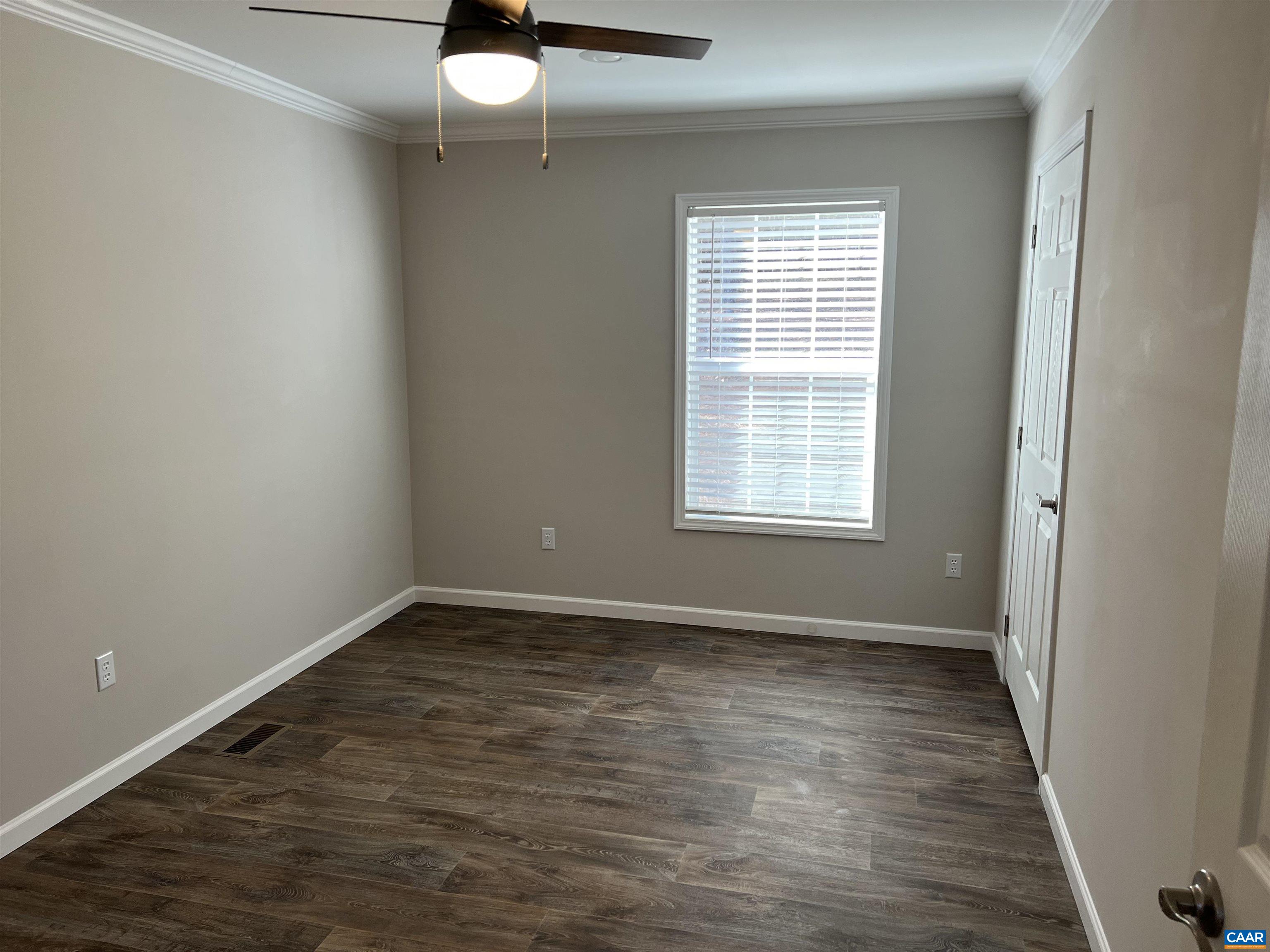 3123 Scottsville Road Charlottesville, VA 22902 - Photo 15 of 22 a view of an empty room with wooden floor and a window