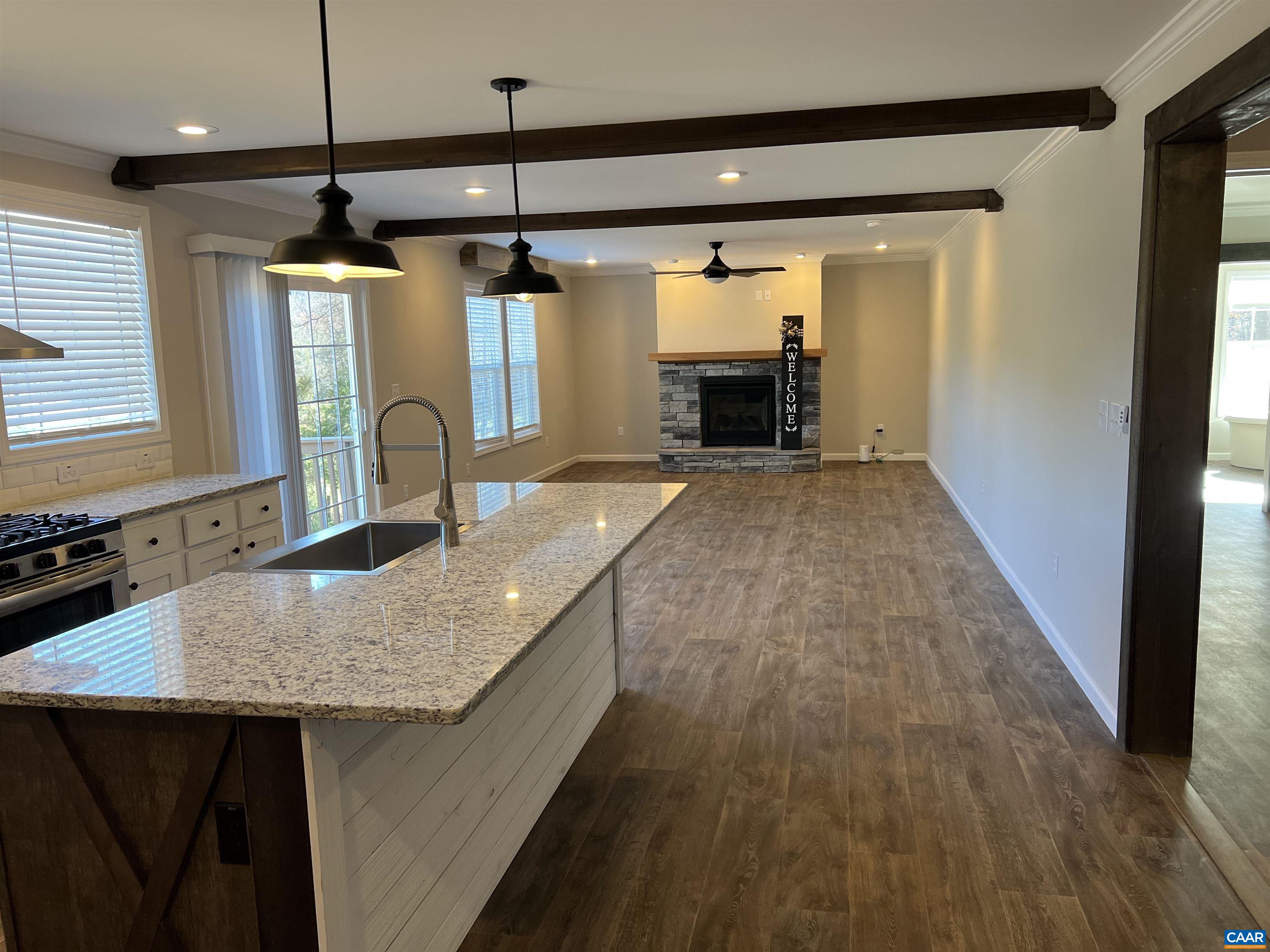 3123 Scottsville Road Charlottesville, VA 22902 - Photo 3 of 22 a kitchen with kitchen island a counter top space a sink a window and stainless steel appliances