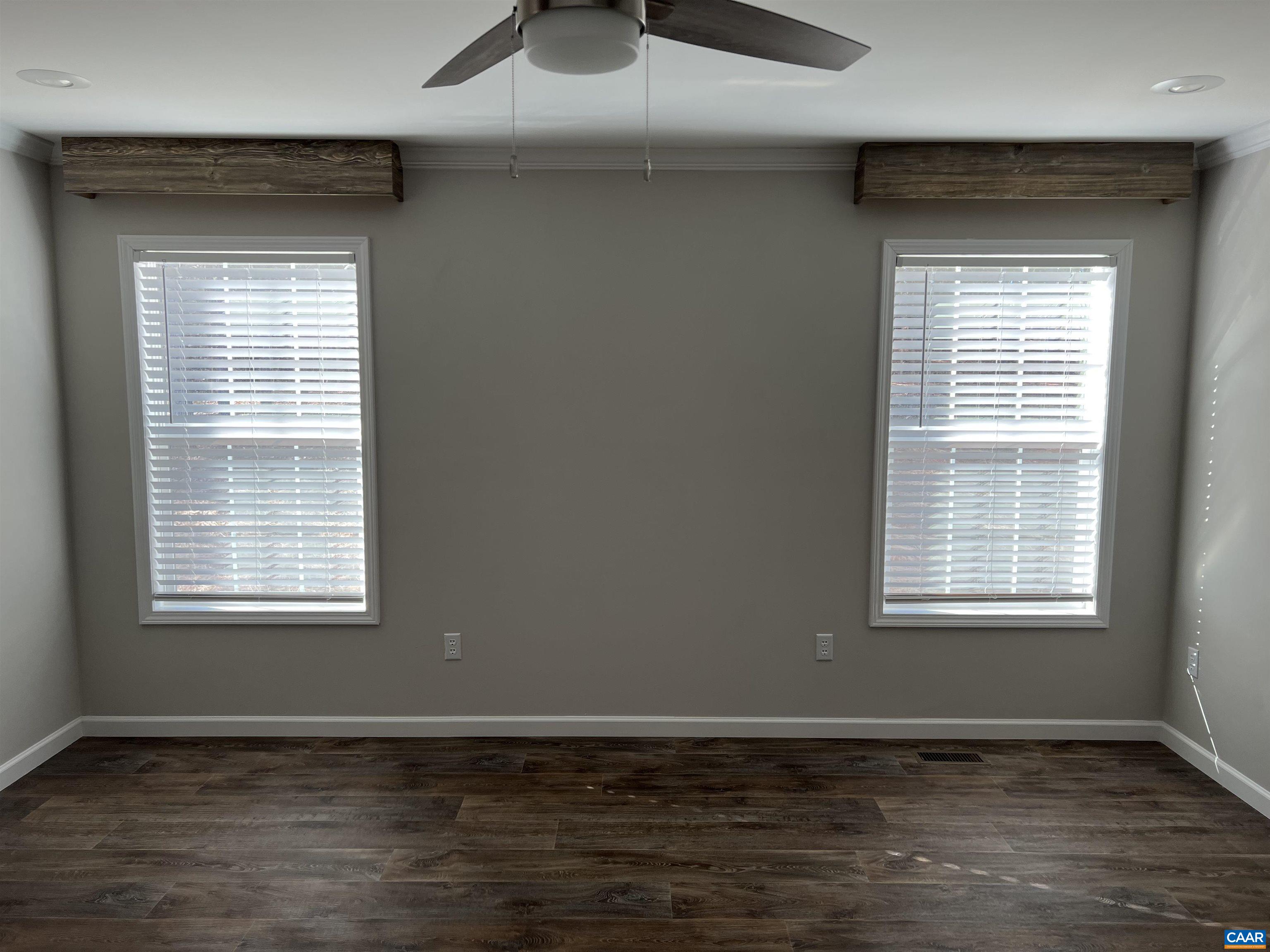 3123 Scottsville Road Charlottesville, VA 22902 - Photo 7 of 22 a view of an empty room with wooden floor and a window