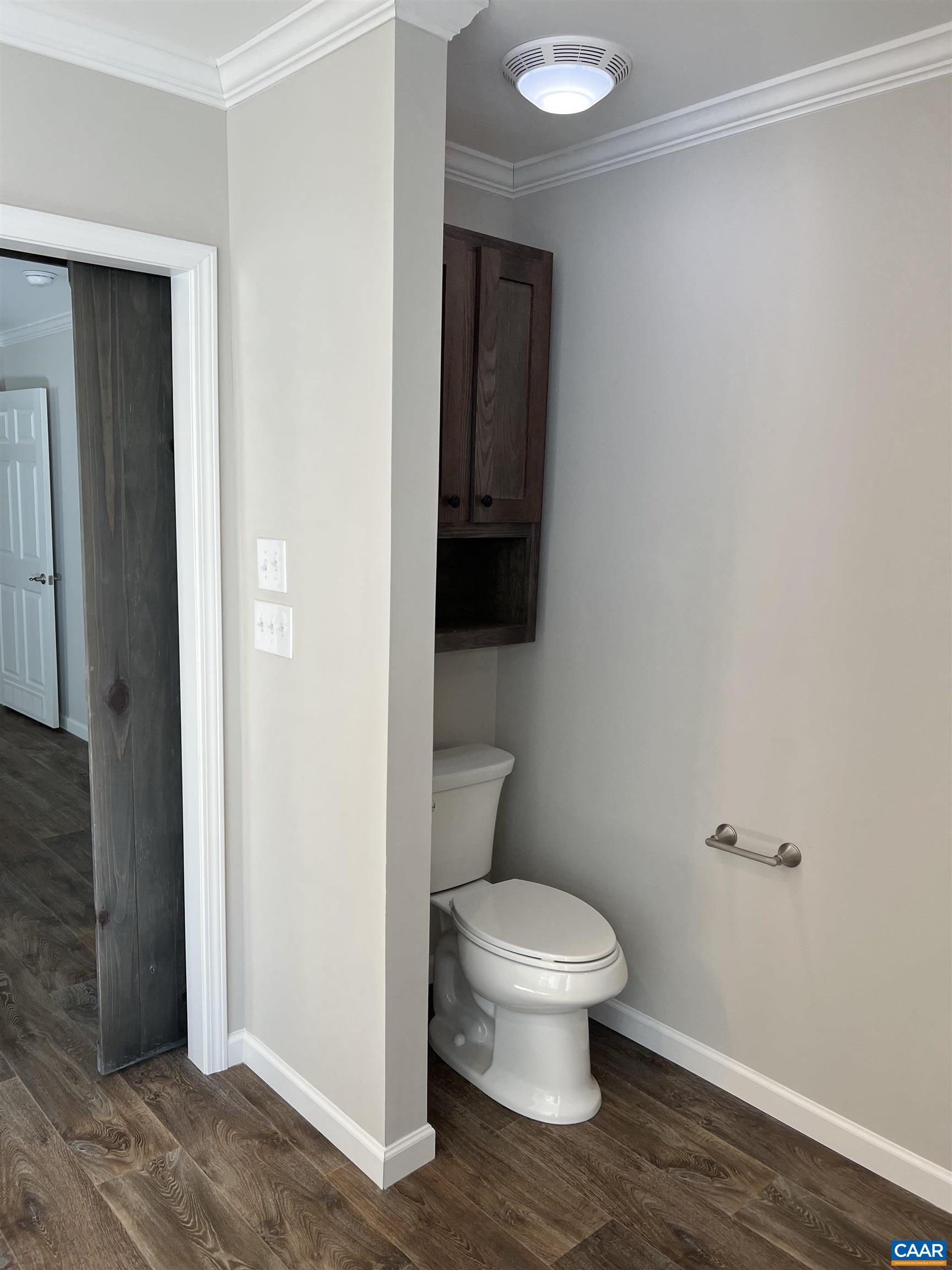 3123 Scottsville Road Charlottesville, VA 22902 - Photo 10 of 22 a white toilet sitting next to a bathroom sink