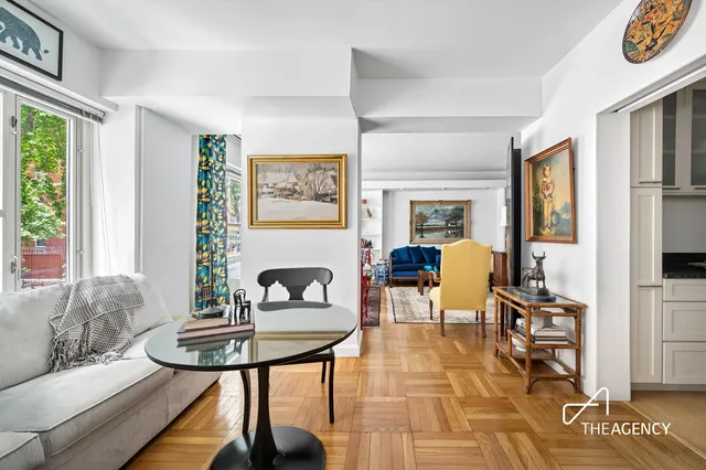 a dining room with furniture and window