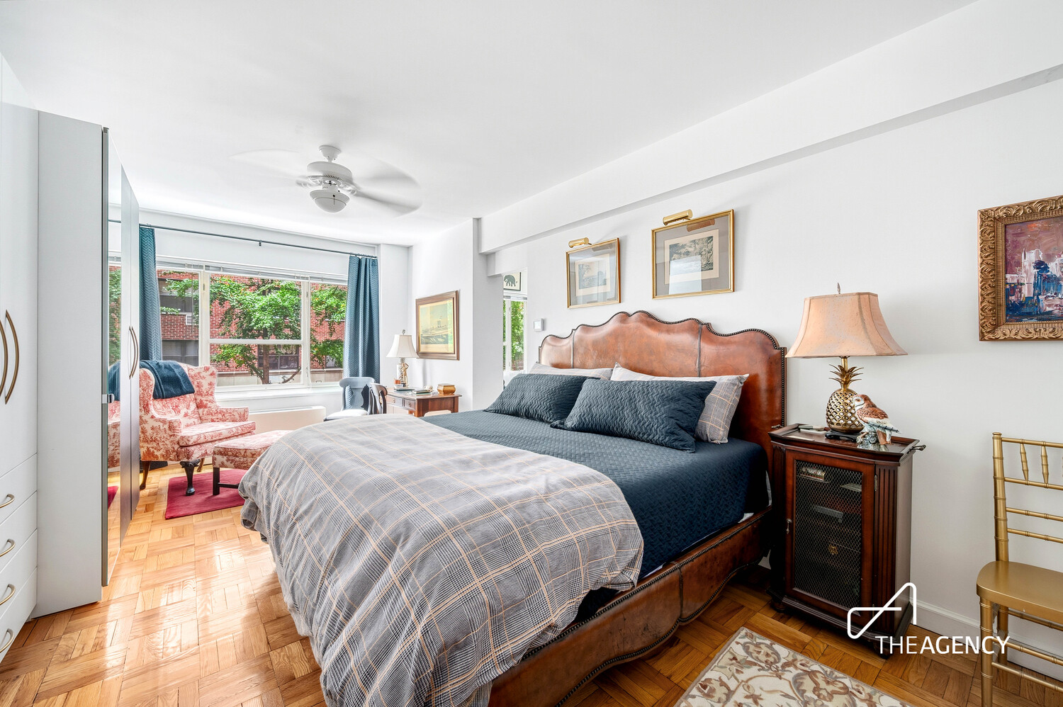 36 Sutton Place South, Unit 2D Manhattan, NY 10022 - Photo 7 of 10 a bedroom with a bed and wooden floor