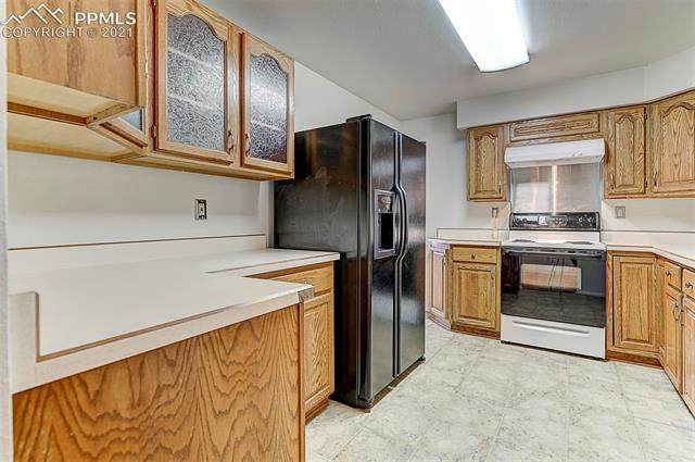 18 North Chelton Road Colorado Springs, CO 80909 - Photo 8 of 32 Notice the custom frosted glass cabinets