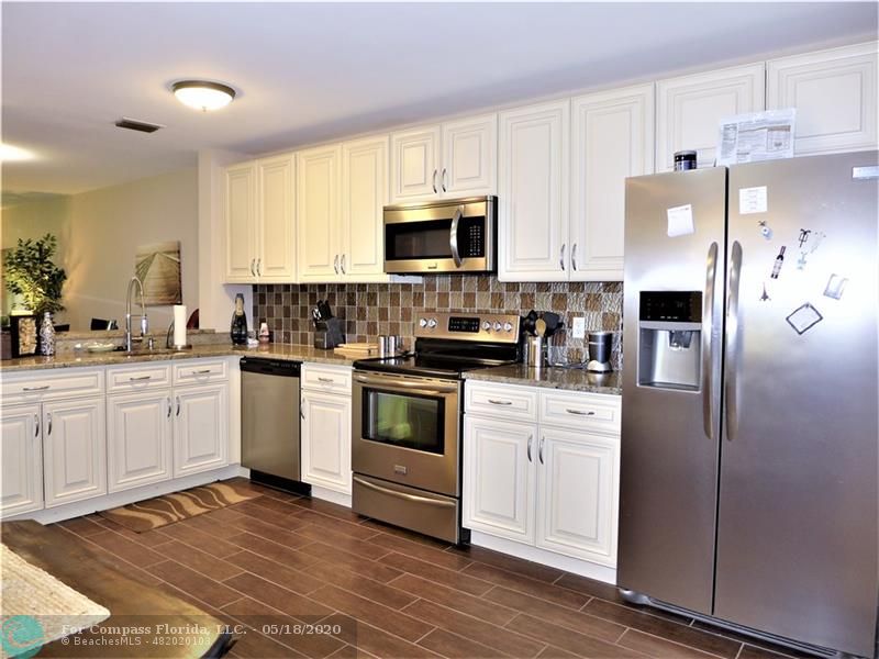New Renovated Kitchen with New high end stainless steel appliances. New Tile flooring and back splash.