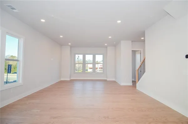 a view of an empty room with a window