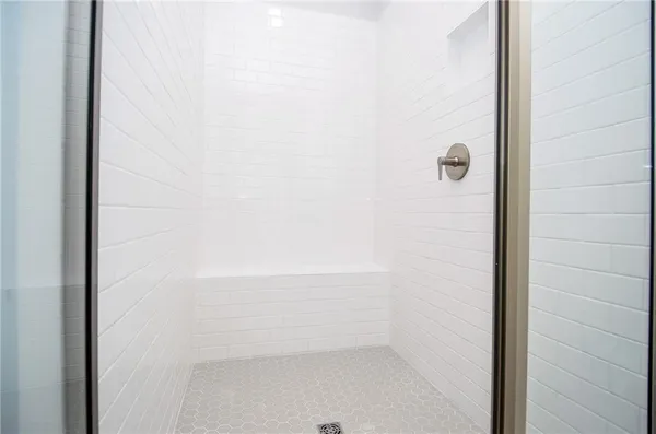 a bedroom with a large bed and a couch