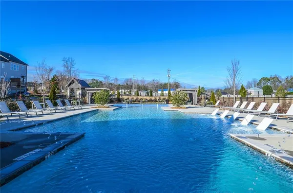 a view of a swimming pool with an ocean view