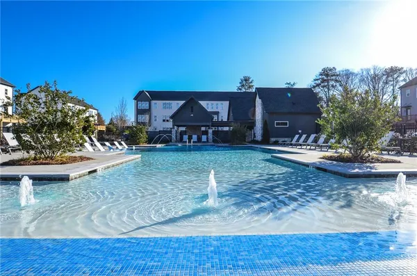an empty room with staircase and white walls