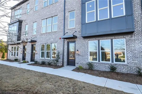 a view of a brick building with many windows