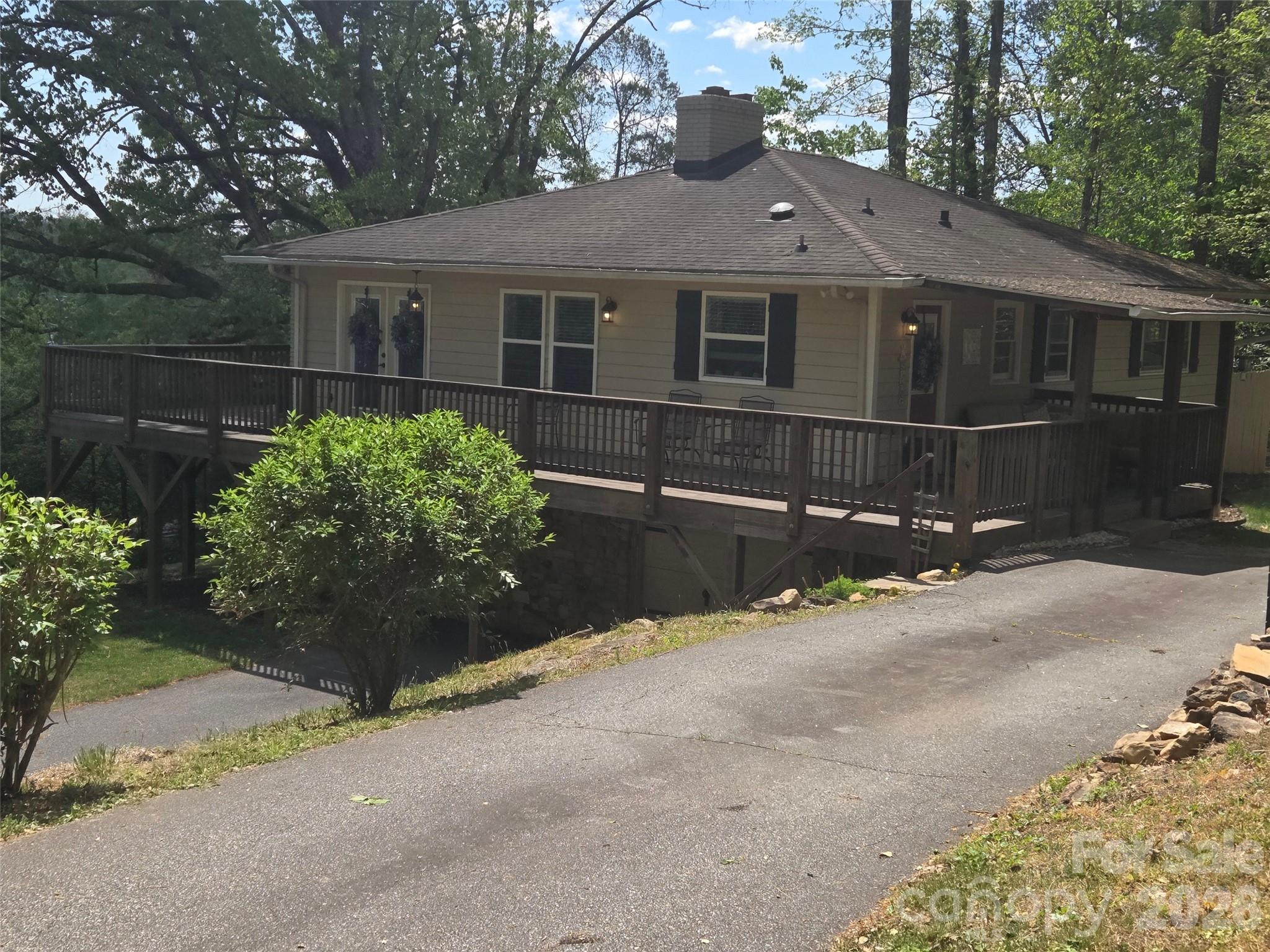 502 Long Shoals Road Arden, NC 28704 - Photo 25 of 32 a front view of a house with a yard and garage