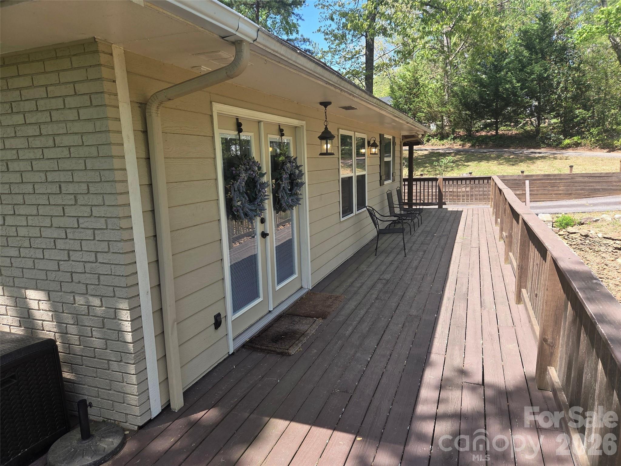 502 Long Shoals Road Arden, NC 28704 - Photo 30 of 32 a view of a balcony with wooden floor and outdoor space
