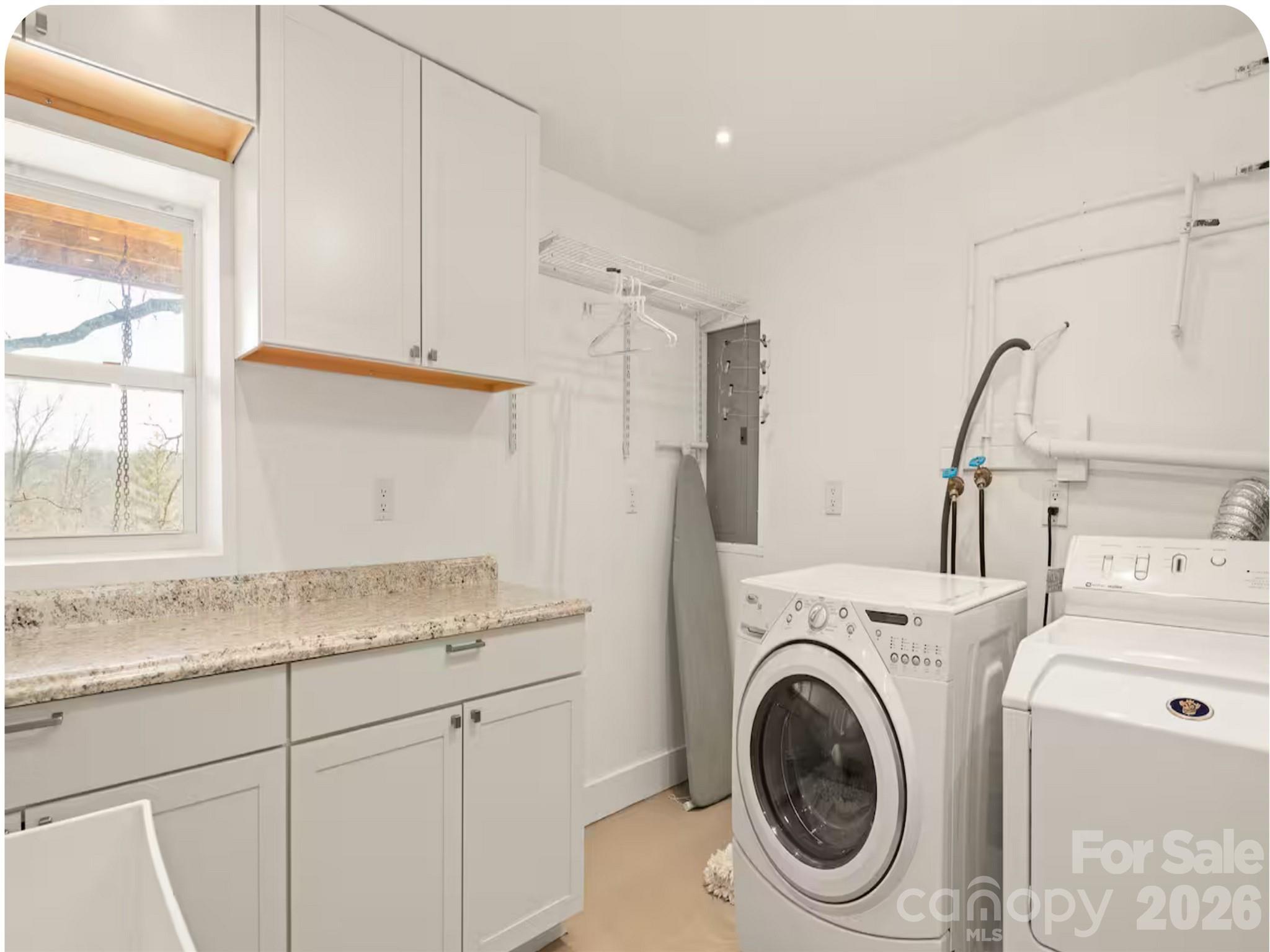 502 Long Shoals Road Arden, NC 28704 - Photo 9 of 32 a utility room with sink dryer and washer