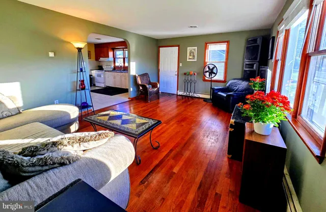 a bed room with a bed window and a chair