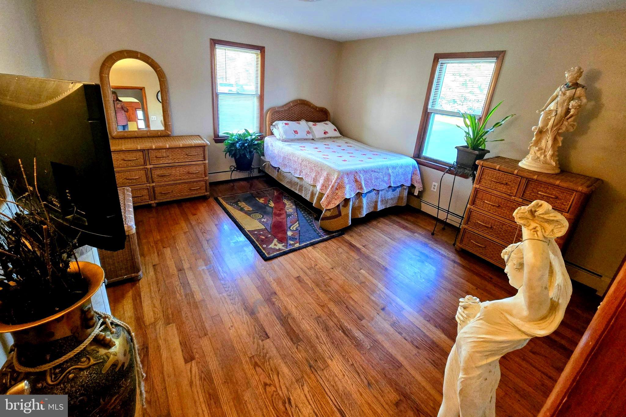 8445 North Old State Road Lincoln, DE 19960 - Photo 14 of 32 a bedroom with a bed and wooden floor