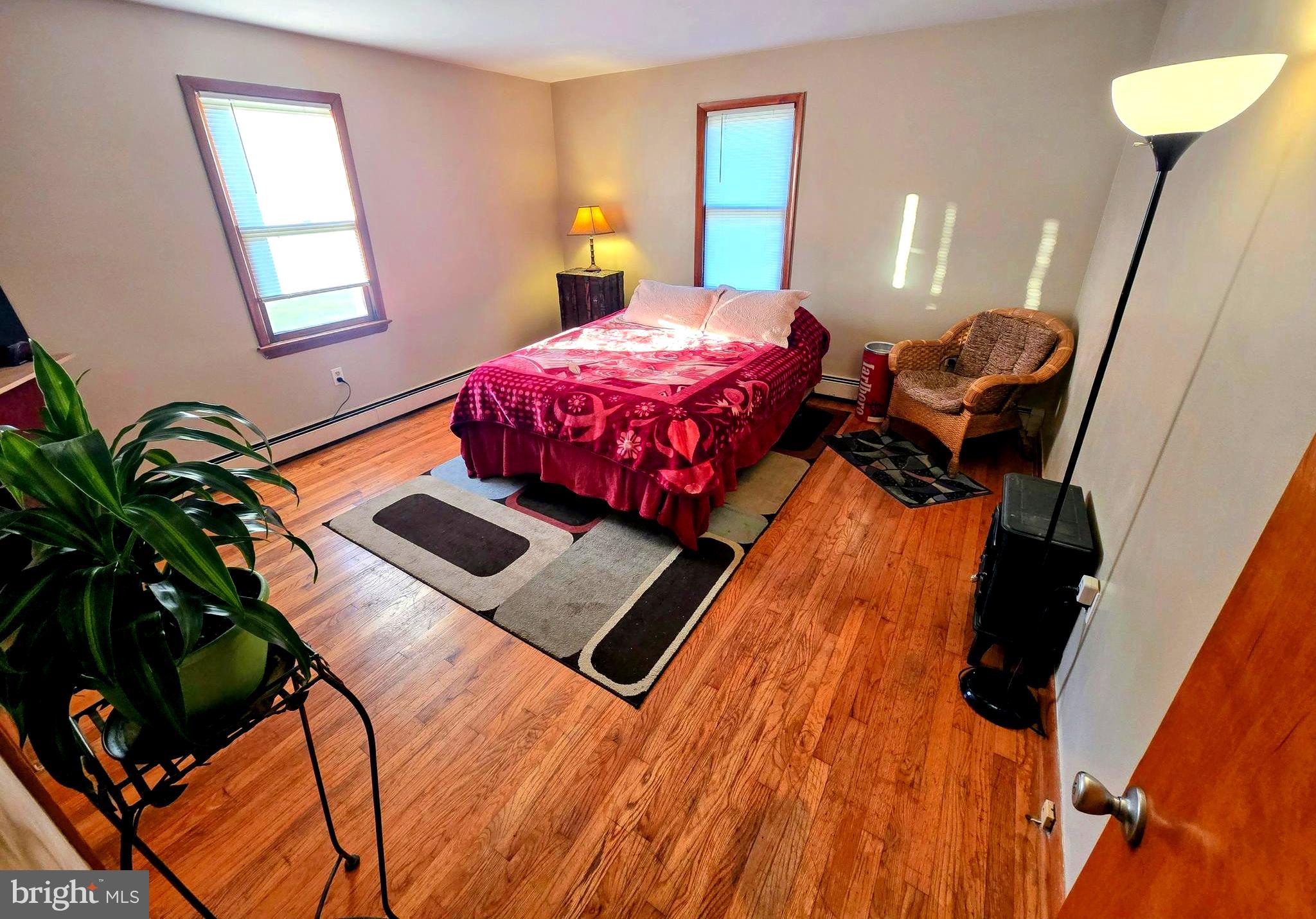 8445 North Old State Road Lincoln, DE 19960 - Photo 16 of 32 a bedroom with a bed window and a potted plant