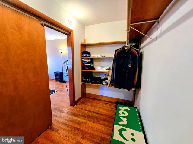 a view of hallway with wooden floor