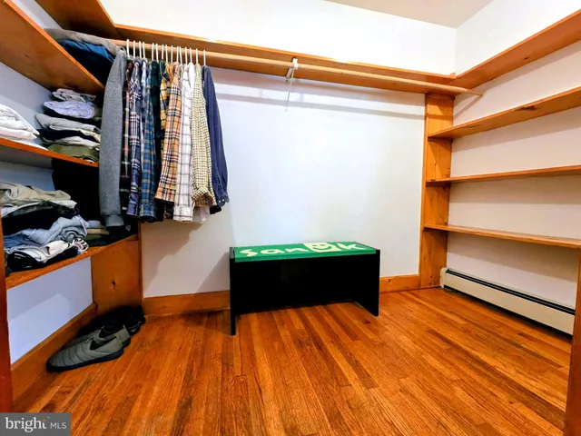 a room with wooden floor and window